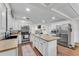 Bright, open kitchen featuring an island with seating, stainless appliances and updated cabinets at 435 Lyle Pkwy, Bartow, FL 33830