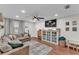 Comfortable living room with a large sectional sofa, neutral colors and wood-look floors at 435 Lyle Pkwy, Bartow, FL 33830