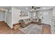 Comfortable living room with a large sectional sofa, neutral colors and wood-look floors at 435 Lyle Pkwy, Bartow, FL 33830