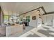 Enclosed patio with outdoor furniture, dart board and view of the surrounding yard at 435 Lyle Pkwy, Bartow, FL 33830