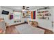 ' playroom offers colorful decor, a cozy rug, and organized book shelves, a window and ceiling fan at 435 Lyle Pkwy, Bartow, FL 33830