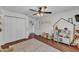 Bright playroom with ' kitchen, a large rug, fan, and closet offers a creative space at 435 Lyle Pkwy, Bartow, FL 33830