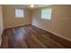 Bedroom featuring wood flooring, natural lighting, and a ceiling fan at 4830 Melody Ln, Lakeland, FL 33805