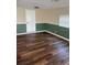 A clean bedroom with fresh paint, new flooring, and a window providing natural light for a welcoming atmosphere at 4830 Melody Ln, Lakeland, FL 33805