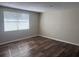 This bedroom has modern flooring, fresh paint, and a window for plenty of natural light, creating a comfortable ambiance at 4830 Melody Ln, Lakeland, FL 33805