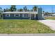 Charming home featuring a well-maintained front yard with mature trees at 4830 Melody Ln, Lakeland, FL 33805