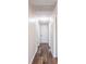 Hallway with new flooring and a centered light fixture at 4830 Melody Ln, Lakeland, FL 33805