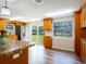 Bright eat-in kitchen offering natural light and warm wood cabinetry at 4830 Melody Ln, Lakeland, FL 33805