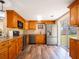 View of the kitchen featuring stainless steel appliances and sliding glass door at 4830 Melody Ln, Lakeland, FL 33805