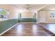 Sunlit living room featuring wood flooring and fresh paint, creating a welcoming atmosphere at 4830 Melody Ln, Lakeland, FL 33805