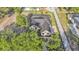 Spacious home featuring a three-car garage, screened pool and spa, and lush landscaping at 5087 Cliffside Drive, Lakeland, FL 33813