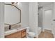 Modern bathroom featuring a tiled shower-tub combo and a neutral vanity with a marble countertop at 5087 Cliffside Drive, Lakeland, FL 33813