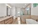 Modern bathroom featuring a large vanity and luxurious walk-in shower at 5087 Cliffside Drive, Lakeland, FL 33813