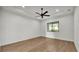 Spacious bedroom with tray ceiling, fan, and a view of backyard at 5087 Cliffside Drive, Lakeland, FL 33813