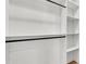 Closet with custom shelving and hanging rods for optimal storage and organization at 5087 Cliffside Drive, Lakeland, FL 33813