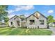Charming single-story house showcasing a stone facade and lush green lawn at 5087 Cliffside Drive, Lakeland, FL 33813