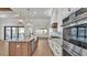 Modern kitchen with an island, stainless steel appliances, and views of the backyard and pool at 5087 Cliffside Drive, Lakeland, FL 33813