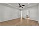 Spacious main bedroom with ceiling fan and ensuite bathroom access at 5087 Cliffside Drive, Lakeland, FL 33813