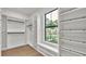 Spacious walk-in closet with custom shelving and storage solutions, offering ample room for organization at 5087 Cliffside Drive, Lakeland, FL 33813