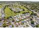Wide aerial image of a golf community, showing homes surrounding the scenic course at 538 Eagle Run, Lakeland, FL 33809