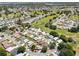 Expansive aerial shot of a community built around a golf course, highlighting its desirable location at 538 Eagle Run, Lakeland, FL 33809