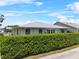 Home exterior with trimmed hedge providing privacy and outdoor living on the patio at 538 Eagle Run, Lakeland, FL 33809