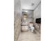 Small bathroom features patterned wallpaper, accent lighting, and a vanity cabinet at 538 Eagle Run, Lakeland, FL 33809