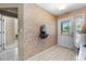 Inviting foyer features tile flooring, an accent wall, and a decorative water fountain at 538 Eagle Run, Lakeland, FL 33809