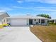 Charming single-story home with a well-maintained front yard and attached two-car garage at 538 Eagle Run, Lakeland, FL 33809