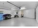 Spacious two-car garage with overhead lighting, storage areas, and plenty of open space at 538 Eagle Run, Lakeland, FL 33809