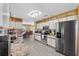 Bright kitchen with granite counters, stainless appliances, and views of the dining area at 538 Eagle Run, Lakeland, FL 33809