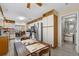 Bright kitchen featuring stainless steel appliances and a view to the breakfast nook and bathroom at 538 Eagle Run, Lakeland, FL 33809