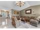 Welcoming living room with neutral tones, tile flooring, and a comfortable sectional sofa at 538 Eagle Run, Lakeland, FL 33809