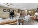 Open concept living area with tile floors and views into the dining area and kitchen at 538 Eagle Run, Lakeland, FL 33809