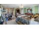 Spacious main bedroom featuring a chandelier and an ensuite bathroom at 538 Eagle Run, Lakeland, FL 33809