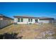 Backyard featuring a white fence, patio, and play equipment at 5534 Turkey Creek Way, Lakeland, FL 33811