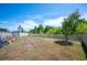 Backyard with white fence, tree, toys, and green vegetation at 5534 Turkey Creek Way, Lakeland, FL 33811