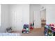 Bright bedroom featuring white doors and carpeted floors at 5534 Turkey Creek Way, Lakeland, FL 33811