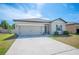 Charming single-Gathering home with a two-car garage and well-maintained landscaping at 5534 Turkey Creek Way, Lakeland, FL 33811