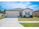 Charming single-Gathering home with a two-car garage and well-maintained landscaping at 5534 Turkey Creek Way, Lakeland, FL 33811