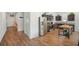 View of kitchen with stainless steel appliances, dark cabinets, granite countertops and breakfast bar at 5534 Turkey Creek Way, Lakeland, FL 33811