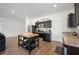 Kitchen with island, dark cabinets, stainless steel appliances and granite countertops at 5534 Turkey Creek Way, Lakeland, FL 33811