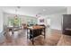Open-concept living area with dining table and view to patio at 5534 Turkey Creek Way, Lakeland, FL 33811