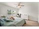 Bright main bedroom with carpet flooring, ceiling fan, large windows and walk in closet at 5534 Turkey Creek Way, Lakeland, FL 33811