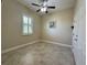 Bedroom featuring a ceiling fan, tile floor and shuttered window at 564 Meandering Way, Polk City, FL 33868