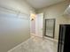 Spacious walk-in closet featuring tile flooring and wire shelving units at 564 Meandering Way, Polk City, FL 33868