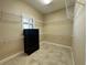 Large walk-in closet with ample shelving and a window at 564 Meandering Way, Polk City, FL 33868