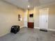 Spacious garage features durable epoxy flooring and convenient built-in cabinet at 564 Meandering Way, Polk City, FL 33868