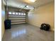 Spacious garage with epoxy floors and an automatic door at 564 Meandering Way, Polk City, FL 33868