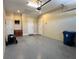 Clean and organized garage space featuring epoxy flooring at 564 Meandering Way, Polk City, FL 33868